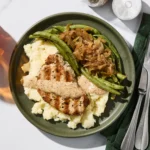 Creamy Garlic Dijon Pork Chops with Mashed Potatoes & Peas