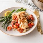 White Fish with Rich Tomato Sauce side Boiled Potatoes and Asparagus