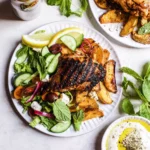 Peri-Peri Chicken, Roasted Potatoes, side Tomato/Cucumber Salad